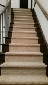 Staircase with carpet center